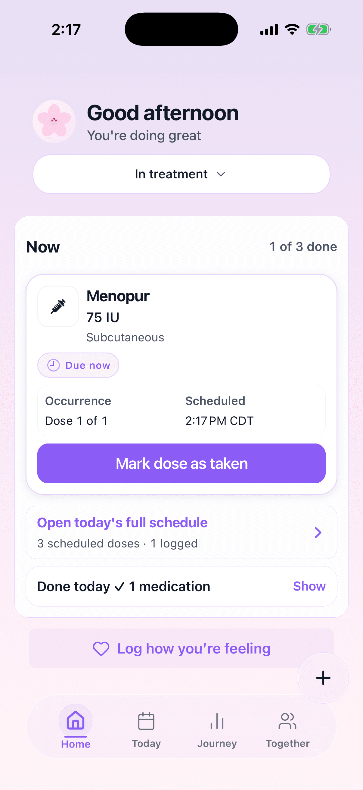 The TrackMyIVF home screen on a stimulation day. The phase is set to "In treatment" and a "Now" card reads "1 of 3 done", showing a single Menopur 75 IU subcutaneous dose marked "Due now" for 2:17 PM above one "Mark dose as taken" button. Below: "3 scheduled doses, 1 logged" and "Done today, 1 medication".